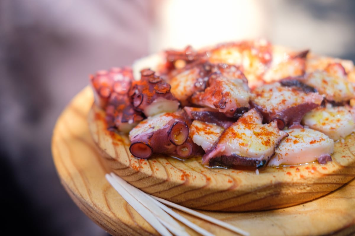 Traditional Pulpo a Feira on a Wooden Board, authentic taste of Galicia
